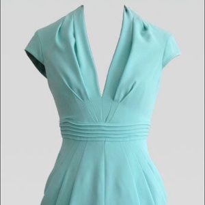 Deep V-neckline cap sleeve draped sheath dress